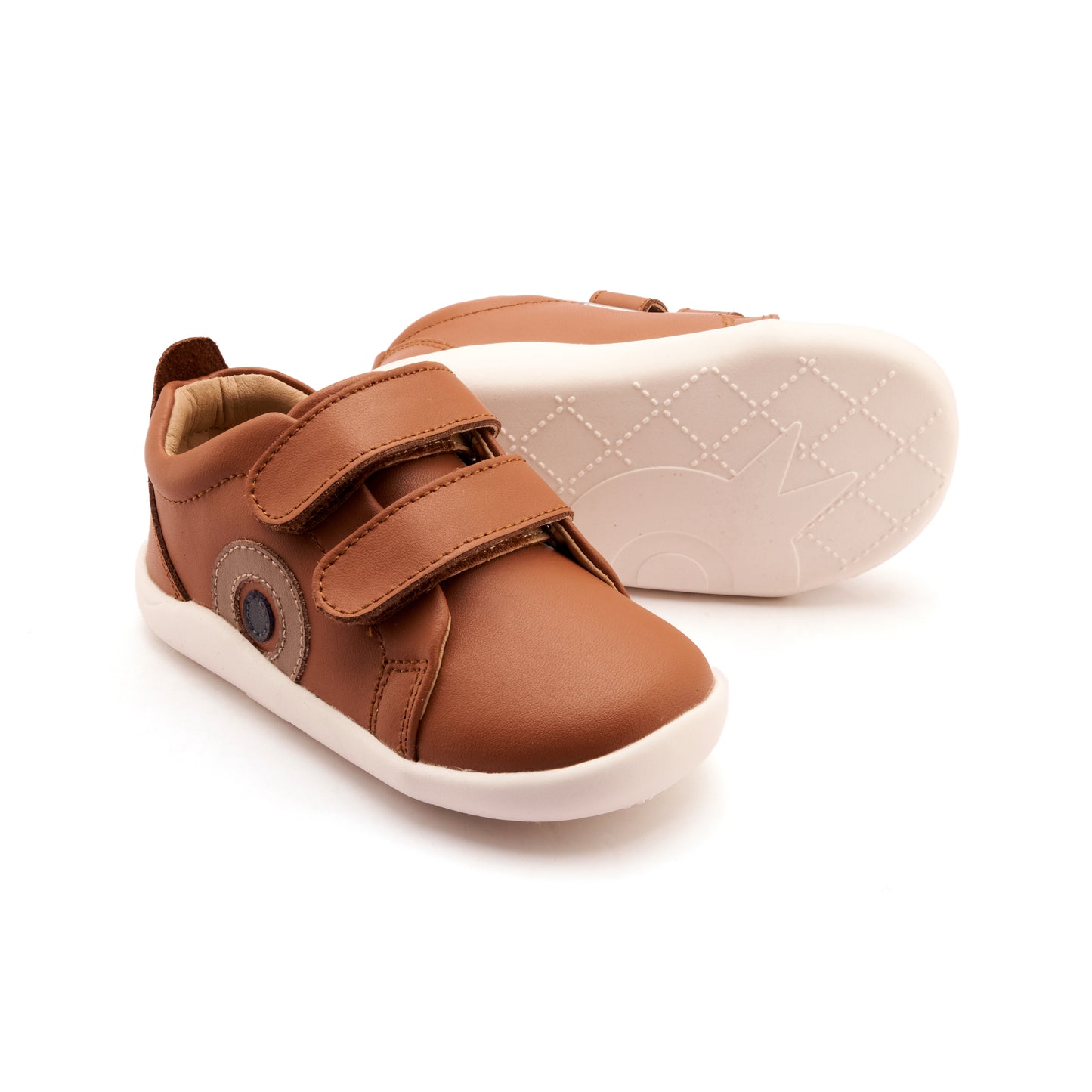 Pair of brown children's shoes on a white background
