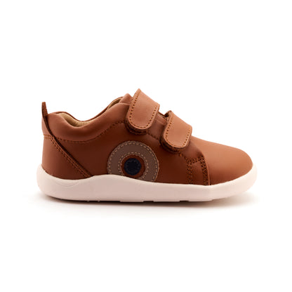 Pair of brown children's shoes on a white background