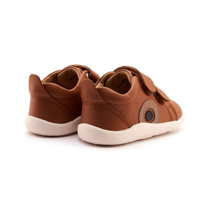 Pair of brown children's shoes on a white background